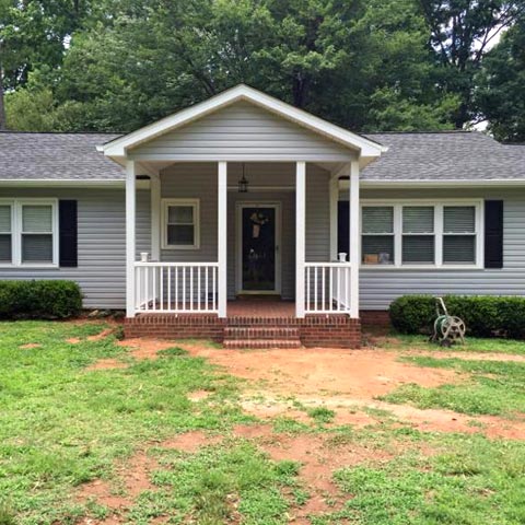 Siding by the Best - gray home with new siding and freshly painted white trim